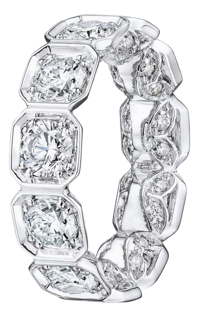 4.90 Carat Round Diamond Bezel Set Octagonal Eternity Wedding Band in 14K White: Natural Diamond Eternity Band set in 14K White gold. 11 Large Round Brilliant diamonds and small pave diamonds are F-G SI1-SI2. Total Carat weight: 4.90ct. Total ring weight: 5.16 grams. Ring size: