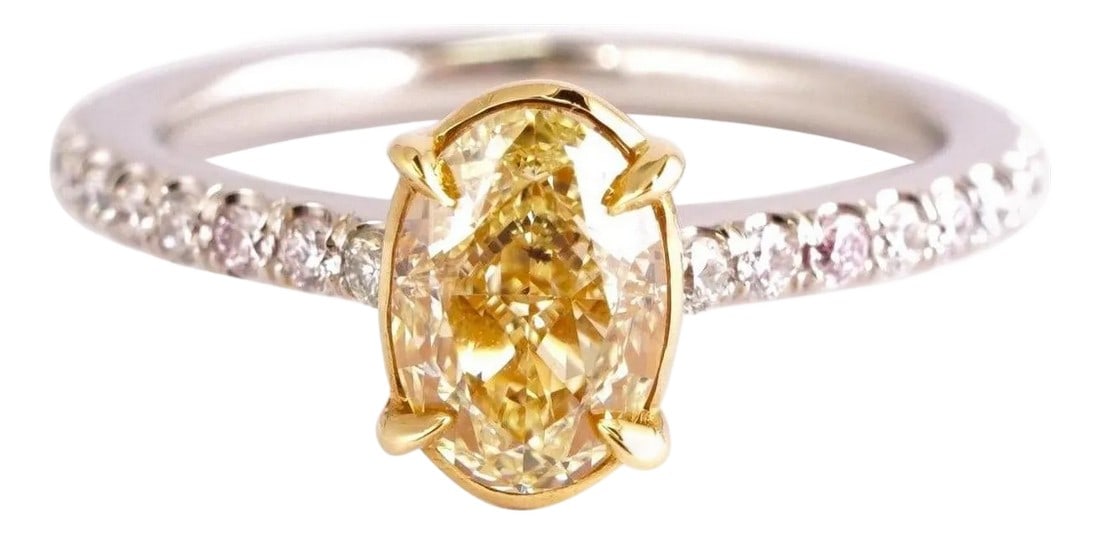 Certified 1.04 Ct Fancy Yellow Oval Cut Engagement Ring in Platinum: Diamond platinum ring with EGL certificate, no.US3143198050D. Center stone: 1.04 ct SI1 Oval cut Fancy Yellow diamond, 7.00 x 4.90 x 4.43mm. Side stones: .32ct H-I-J VS1-SI1 Brilliant round diamonds.