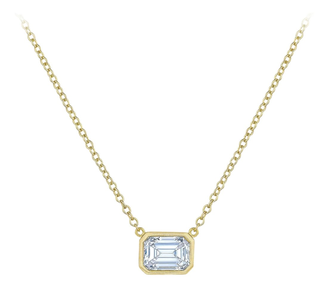 GIA certified 1.00 carat F VS2 emerald cut diamond East-West pendant: Bezel Pendant Necklace - GIA certified Emerald 1.00ct, F VS2, set in a bezel setting, with 16 inch length, 18 Karat Yellow Gold cable chain. Please allow for 3-4 week lead time. Approximate