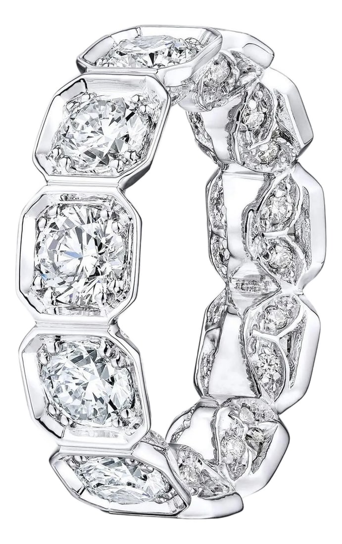 5.00 Carat Bezel Set Octagonal Diamond Eternity Band, Size 6.75: Diamond Eternity Band set in 14K White Gold. 11 Large Round Brilliant diamonds and small pave diamonds are F-G SI1-SI2. Total Carat weight: 5.00ct. Total ring weight: 5.9 grams. Ring size: 6.75.