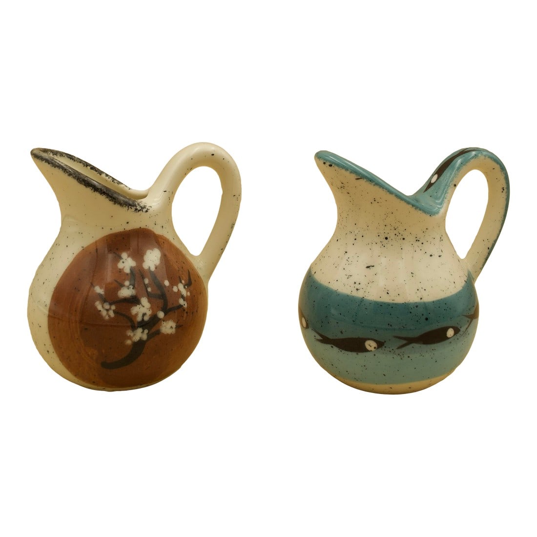 Pair of Jobi Studio Pottery Pitchers, Cape Cod, Mid-Century Modern, C. 1960s: A matched pair of hand-thrown studio pottery pitchers by Jobi Pottery, produced on Cape Cod circa the 1960s. Each pitcher features a softly speckled glaze and expressive hand-painted decoration, one