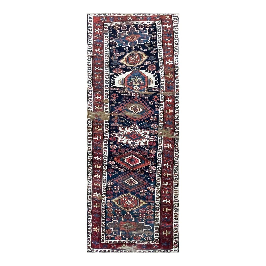 Antique Shirvan Caucasian Long Rug, as Is: The historic Khanate or administrative district of Shirvan produced many highly decorative antique rugs that have a formality and stylistic complexity that is found in few rugs from the Caucasus. The
