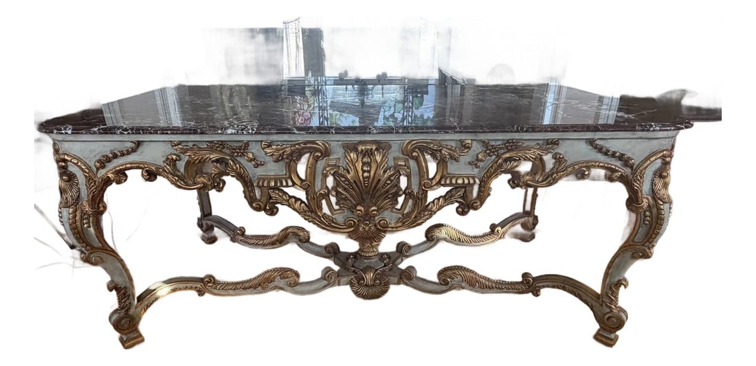 Antique French Rococo Revival Marble Top Table With Gilt Carved Base, Circa 1900: Exceptional antique French Rococo Revival table featuring a richly veined marble top resting on an elaborately carved giltwood base. The sculptural apron and stretcher display shell, scroll, and