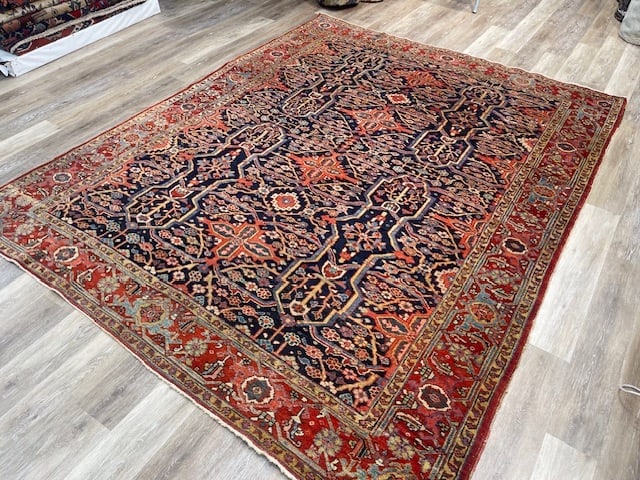 Unique Persian Heriz Rug-VG: Title:Unique Persian Heriz Rug-VGDescription:Handwoven wool rug measuring approximately 7 ft 7 in x 10 ft. This authentic antique Heriz features a deep indigo-blue field with a striking allover