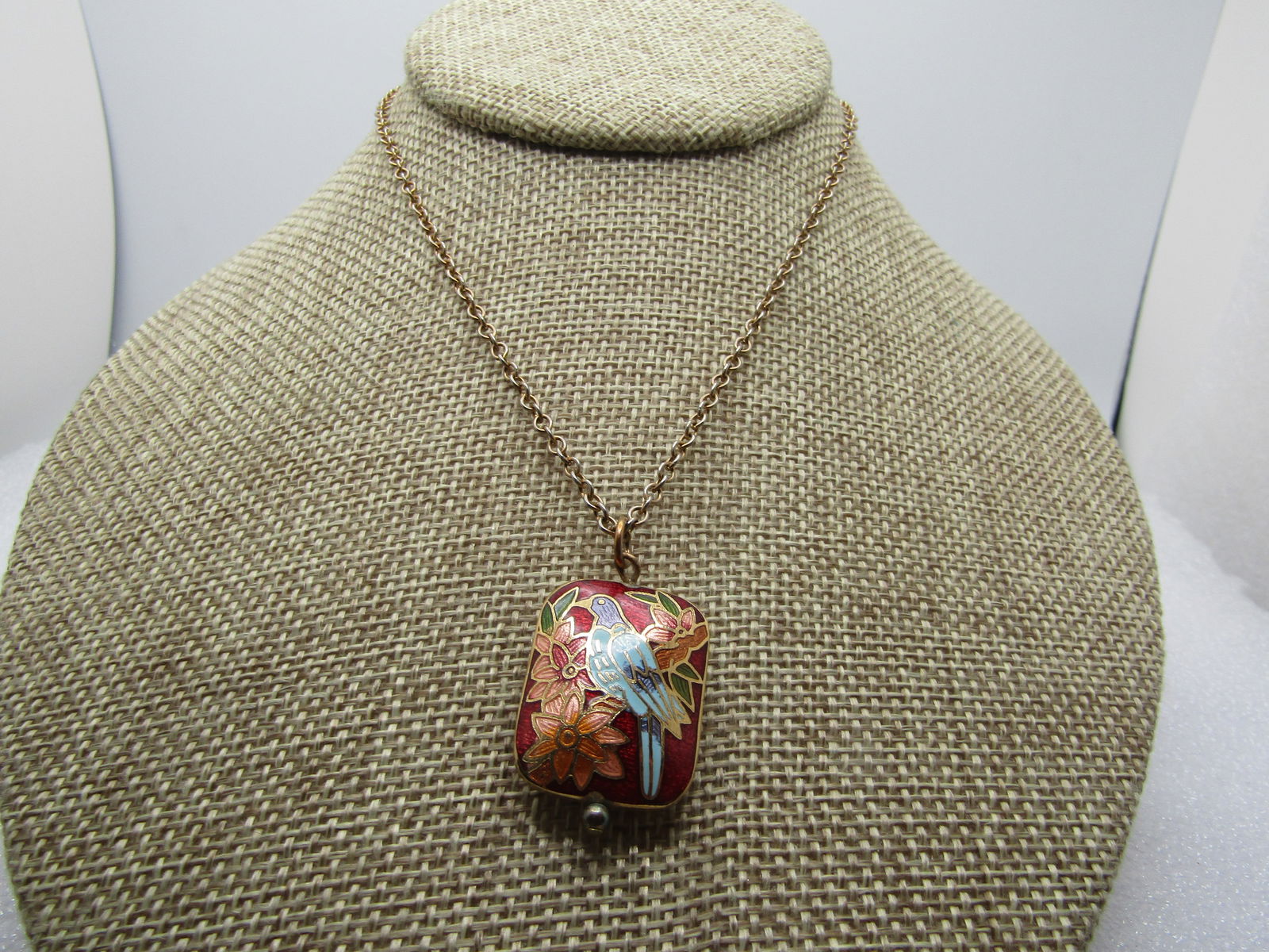 Vintage Bird & Flower Guilloche Necklce, 19", 1970's: Vintage Bird & Flower Guilloche Necklce, 19", 1970's. The pendant is a puffy rectangle with the image on both sides - a blue and lavender bird wit peach and red flowers and green leaves with red