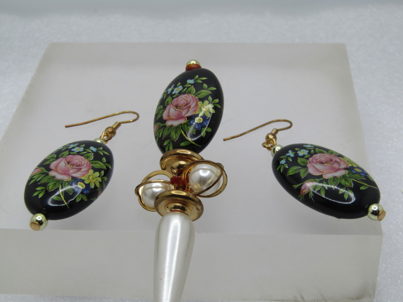 Vintage Pink Rose Hat Pin & Pierced Earrings, Dangle, 1980's: Vintage Pink Rose Hat Pin & Pierced Earrings, Dangle, 1980's. Black long oval beads and two-sided with the same image of a pink rose with gold finish details on the rose and stem and leaves in shades