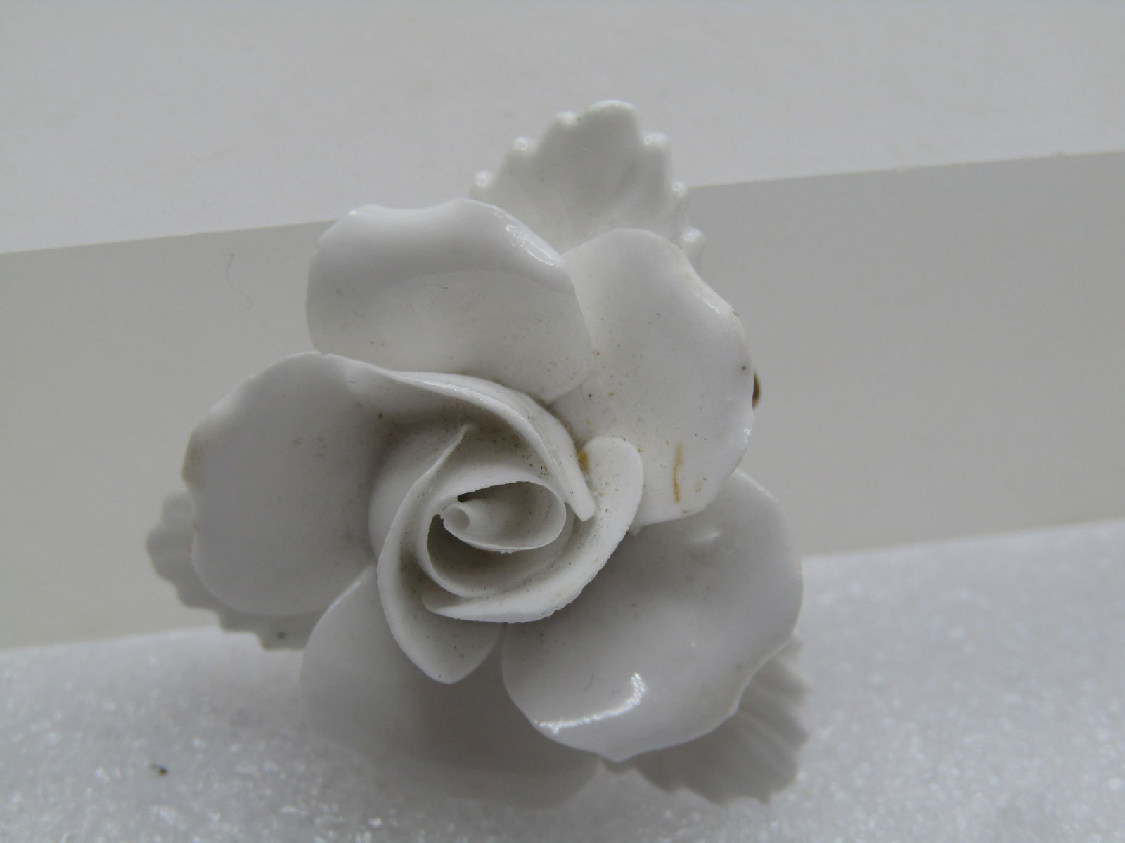 Vintage Painted White Rose Porcelain Brooch, Signed Denton with a crown, England, 1960's: Vintage Painted White Rose Porcelain Brooch, Signed Denton with a crown, England, 1960's. All white porcelain - blossom and leaves. It is slightly under 1.5" wide. The leaves are in a triangular