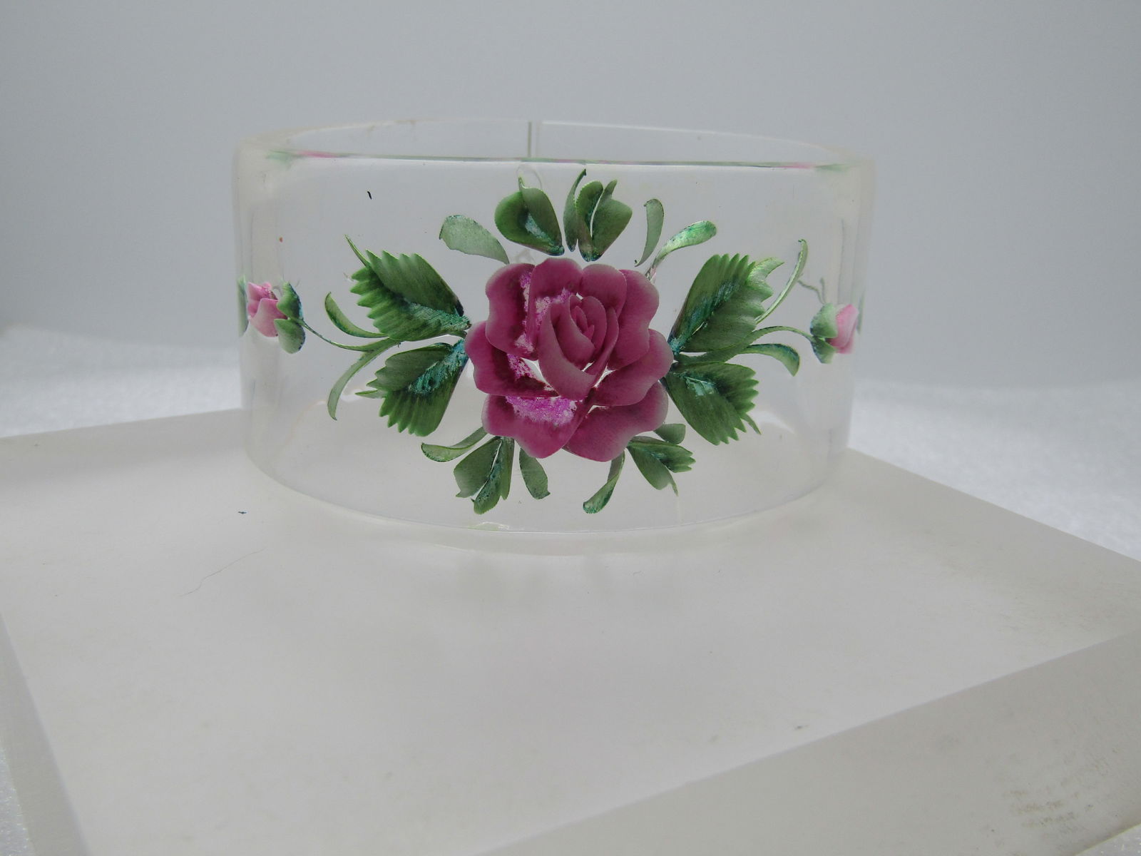 Vintage Reverse Carved Painted Bangle Bracelet, 8.25", Clear Lucite, 1960's: Vintage Reverse Carved Painted Bangle Bracelet, 8.25", Clear Lucite, 1960's. This is 1.5" wide and has a slim opening at the back of the wrist. The bracelet measures 8.25" with a 2-7/8" opening. 