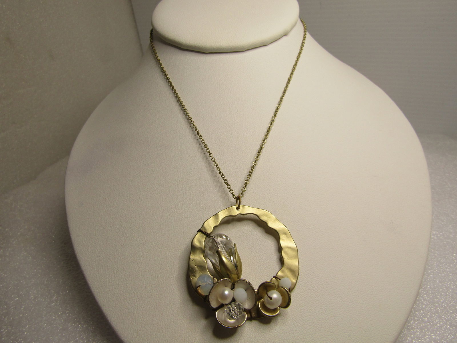 Hammered Crystal, Faux Pearl Necklace by Geranium, USA, 1990's 20": Hammered Crystal, Faux Pearl Necklace by Geranium, USA, 1990's 20". Floral themed, gold tone with a hammered open gold tone frame tht has a blossom like cut crystal on the left side and blossoms