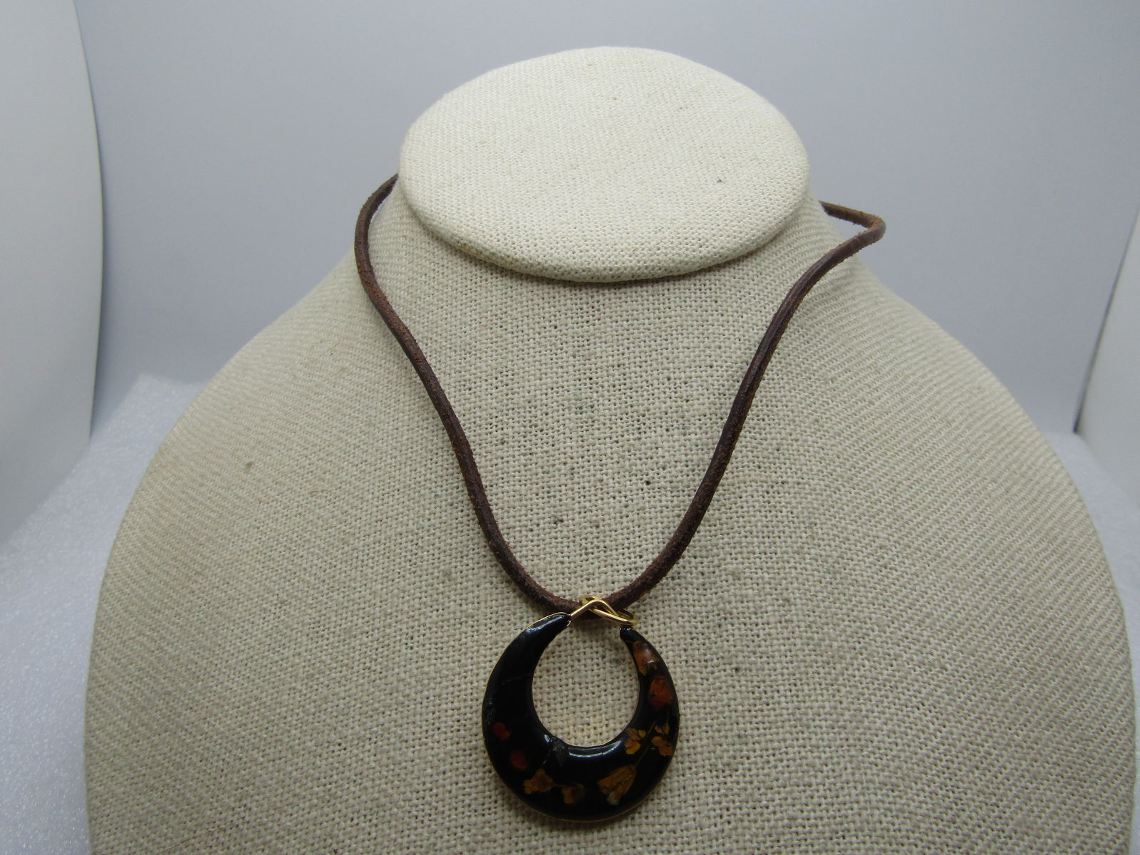 Vintage Inlaid Dry Floral Crescent Hoop Necklace 14" Choker, 1970's-1980's: Vintage Inlaid Dry Floral Crescent Hoop Necklace 14" Choker. 2mm Brown round cord necklace 14" with spring clasp. The pendant is a crescent hoop that is appx. 1.25" long and 1" wide. Has the look of a