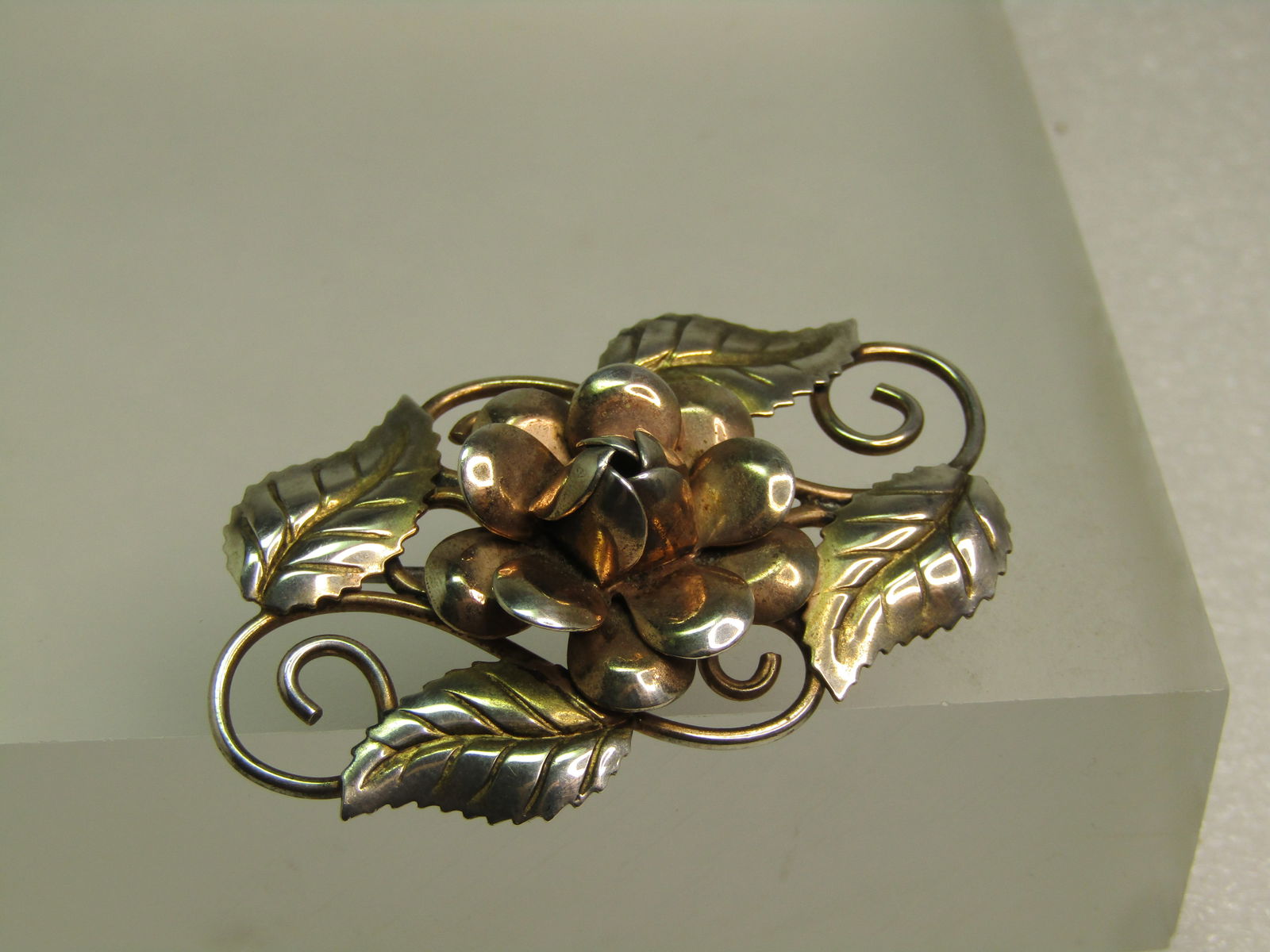 Vintage Sterling Blossom & Leaves Brooch, Two-Tone, 1940's: Vintage Sterling Blossom & Leaves Brooch, Two-Tone, 1940's. This has a lef design with coiled accents and a raised The leaves and coils are sterling silver with the blossom have a gold wash over the s
