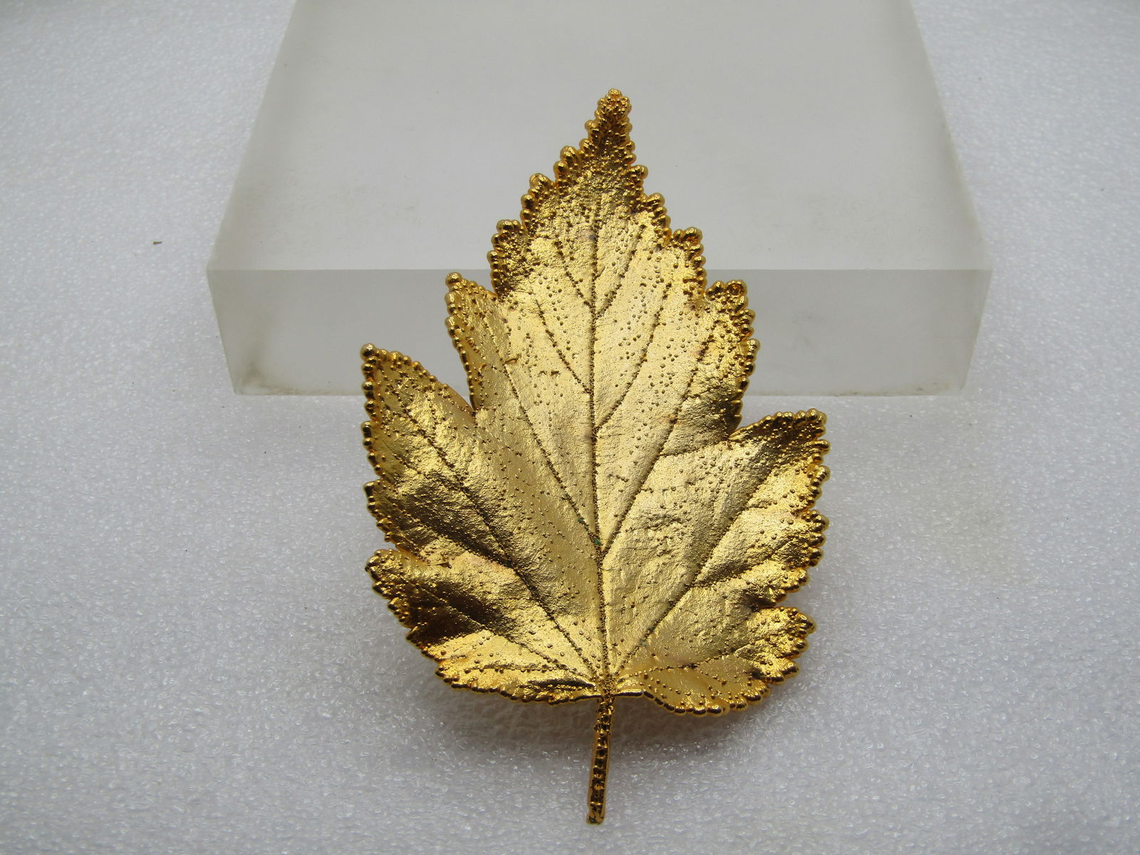 Gold Plated Maple Leaf Brooch, 1970's-1980's: Gold Plated Maple Leaf Brooch, 1970's-1980's. This is a large brooch at appx. 3.75" by 2.5". It appears to be a real leaf that is plated as was popular back in the 1970's and 1980;s. The pinback