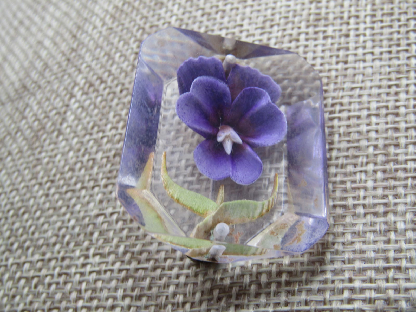 Vintage Reversed Carved Violets Brooch, Lucite, 1950's-1960's: Vintage Reversed Carved Violets Brooch, Lucite, 1950's-1960's. This is rectangular with a shorter back and angled sides. It has two reversed carved violet with what looks like one behind it and