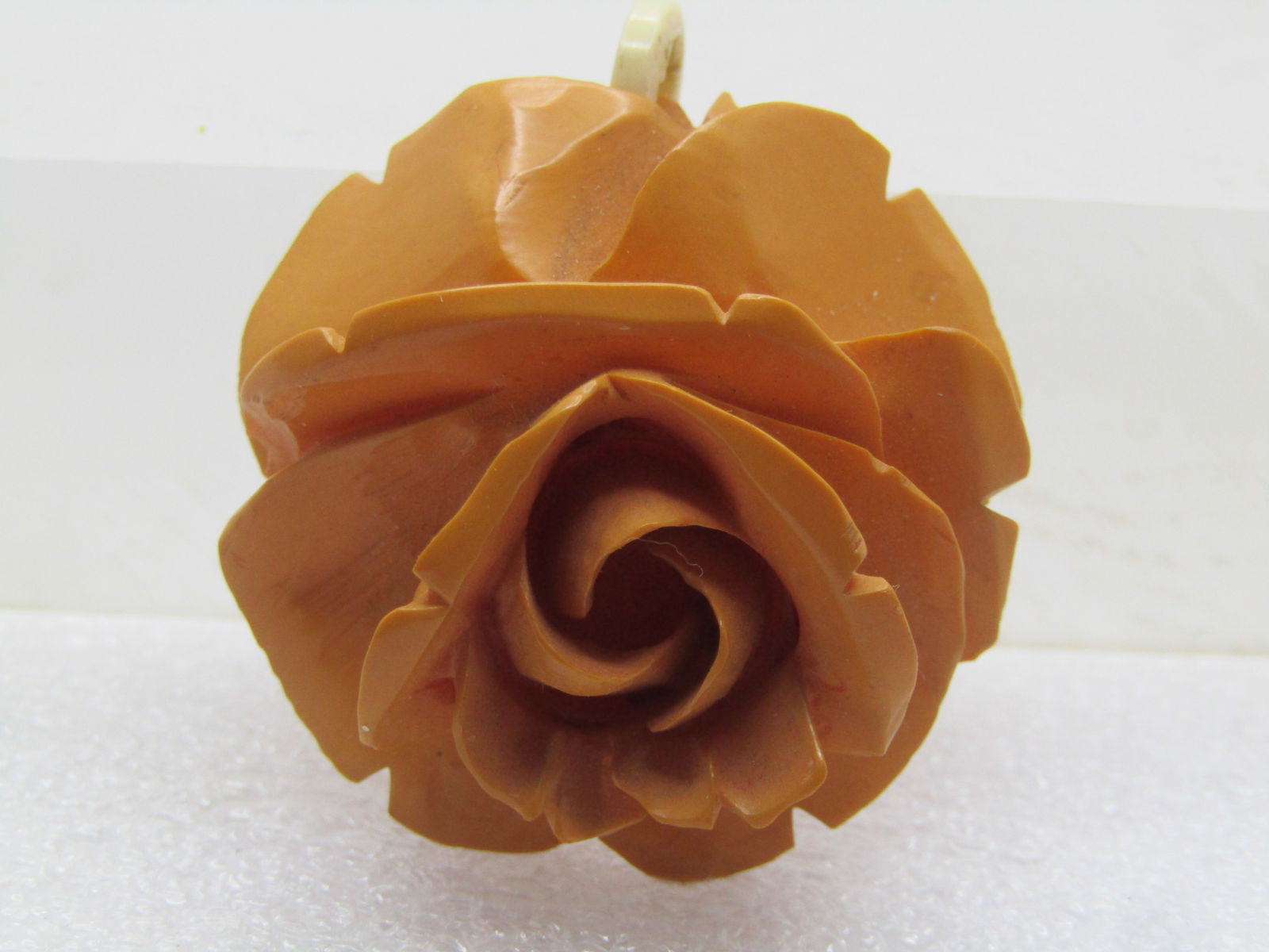 Vintage Carved Rose Pendant, Butterscotch, Mid-Century: Vintage Carved Rose Pendant, Butterscotch, Mid-Century, possibly earlier. I cannot tell if this is a molded rose that looks carved or a wooden carved rose. It is lighter weight than what you'd