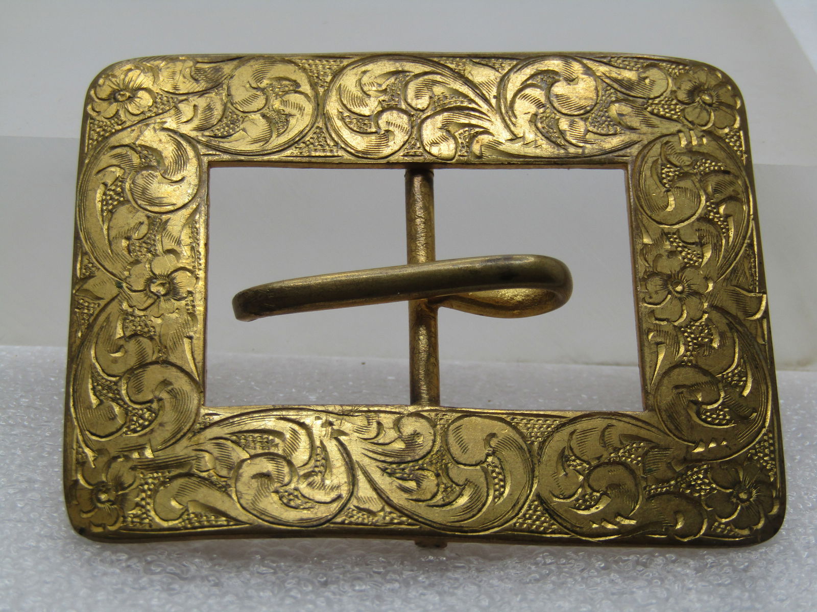 Antique Rectangular Sash Buckle, Shiny Brass, 2.5", 1800's-1920's: Antique Rectangular Sash Buckle, Shiny Brass, 2.5" wide and 2" tall, 1800's-1920's. Victorian Era or shortly therafter. It has the bar down the center with a buckle hook horizontal in the opening. 