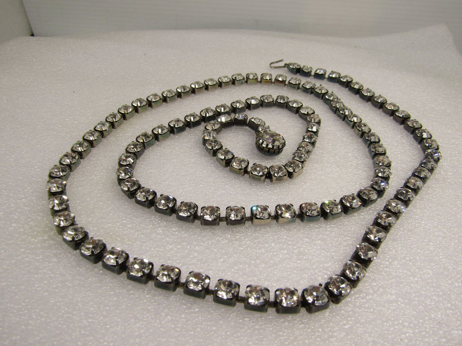 Vintage Twisted Leaf Brooch, 1970's-1980's: Vintage Twisted Leaf Brooch, 1970's-1980's. This has two open work blade leaves that are twisted mid-stem to the bottom creating a V-shape. It is appx.3" on one side and 2.25" on the other and 2" wide