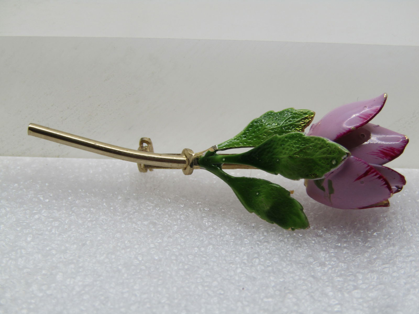Vintage Lavender Enameled Tulip Brooch with Red Tip, 1960's: Vintage Lavender Enameled Tulip Brooch with Red Tip, 1960's. Gold tone stem with three green enameled leaves and a tulip with lavender petals and red enameled accents on the tips. It is not marked