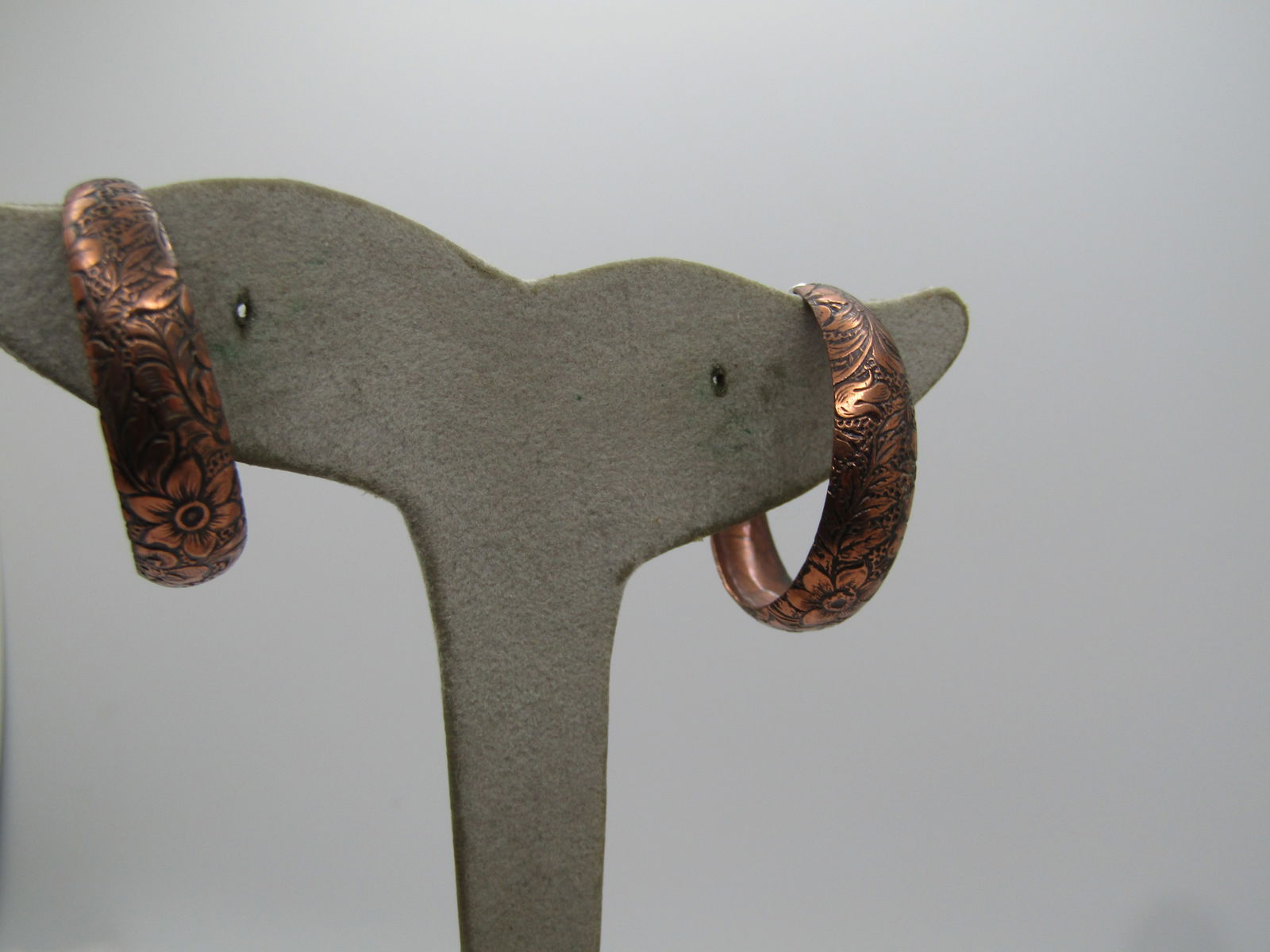 Vintage Copper Floral Hoop Earrings, Pierced, 1960's-1970's: Vintage Copper Floral Hoop Earrings, Pierced, 1960's-1970's. The earrings are tapered at the ends and wider and domed at the center. The earrings are slightly over 1" long and appx. 8mm wide at the ce