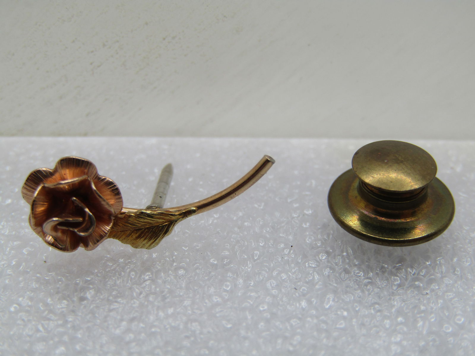 Vintage Three Tone Rose Stick Pin, Tie Tack, 1980's-1990's: Vintage Three Tone Rose Stick Pin, Tie Tack, 1980's-1990's. This is a cute tack pin that has a rose gold rose blossom with yellow gold stem and leaf, and a silver pin. It has a curved stem and is appx