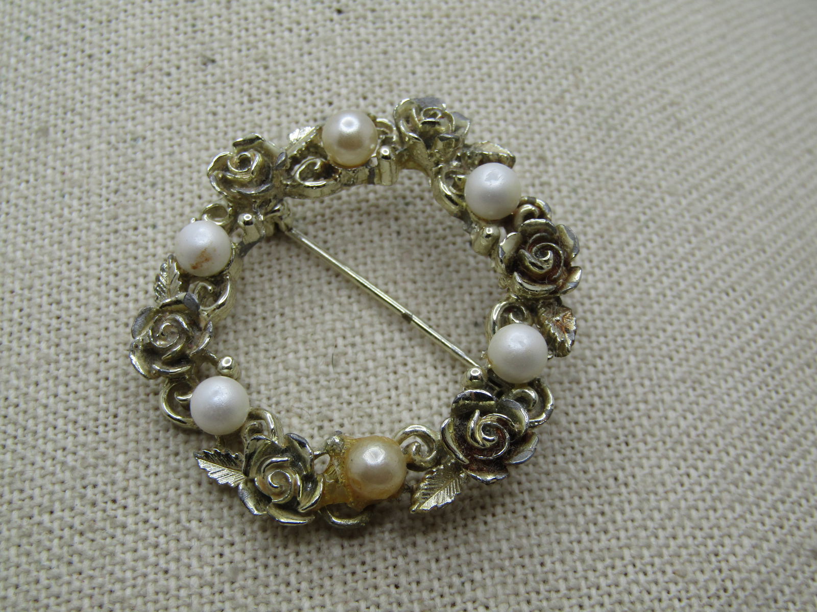 Vintage Red/White Enameled Floral Brooch, 1950's: Vintage Red/White Enameled Floral Brooch, 1950's. This is 3.25" tall and 2.5" wide with an open grid design to the petals that are white enameled and have red enameled tips with a center to the