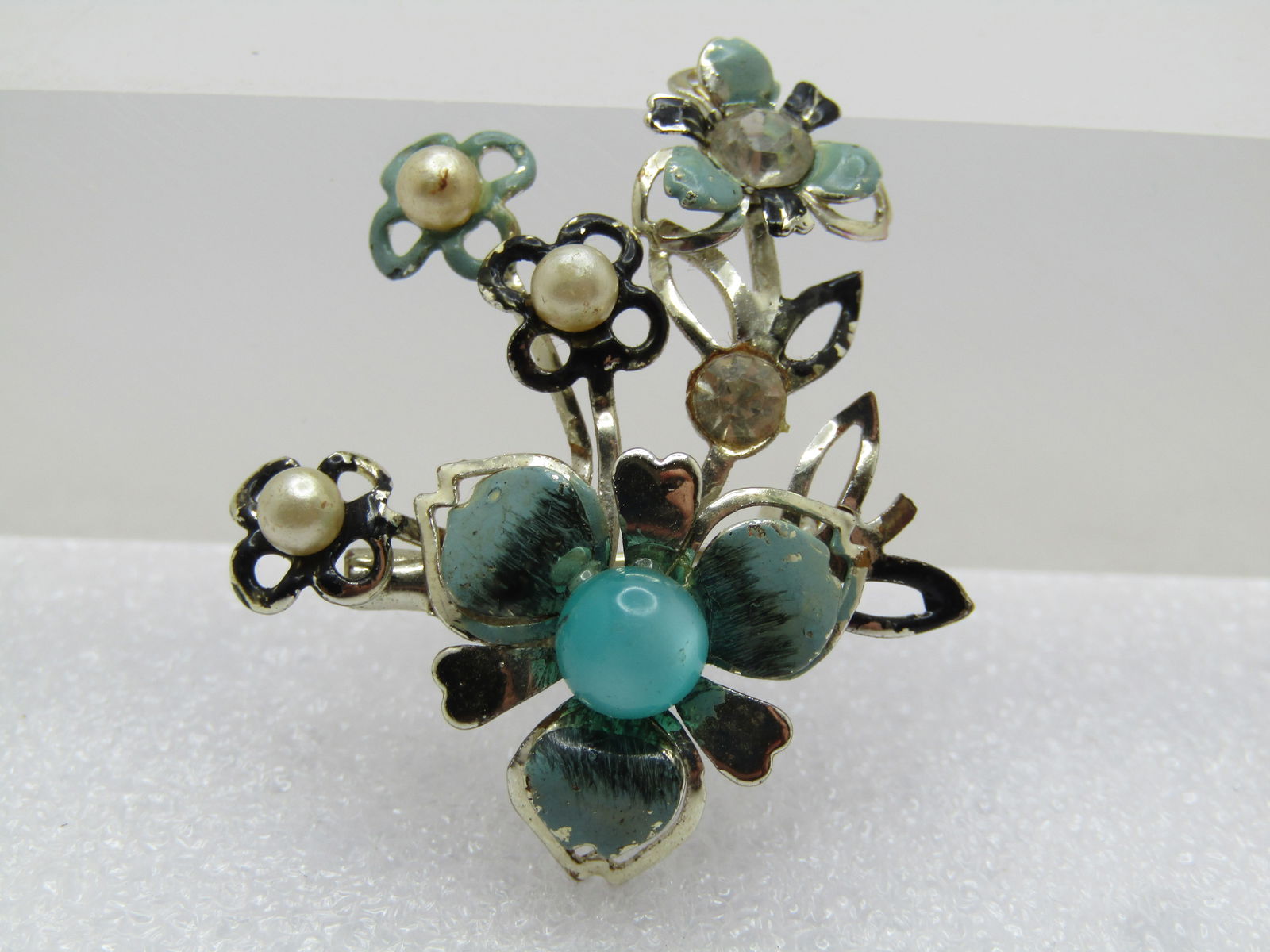 Vintage Faux Pearl, Green Moonglow Floral Brooch, 1950's-1960's: Vintage Faux Pearl, Green Moonglow Floral Brooch, 1950's-1960's. 1" by 1.5", gold tone with five blossoms three with faux pearls, rhinestones and one with a green moonglow 3.5mm bead. Some