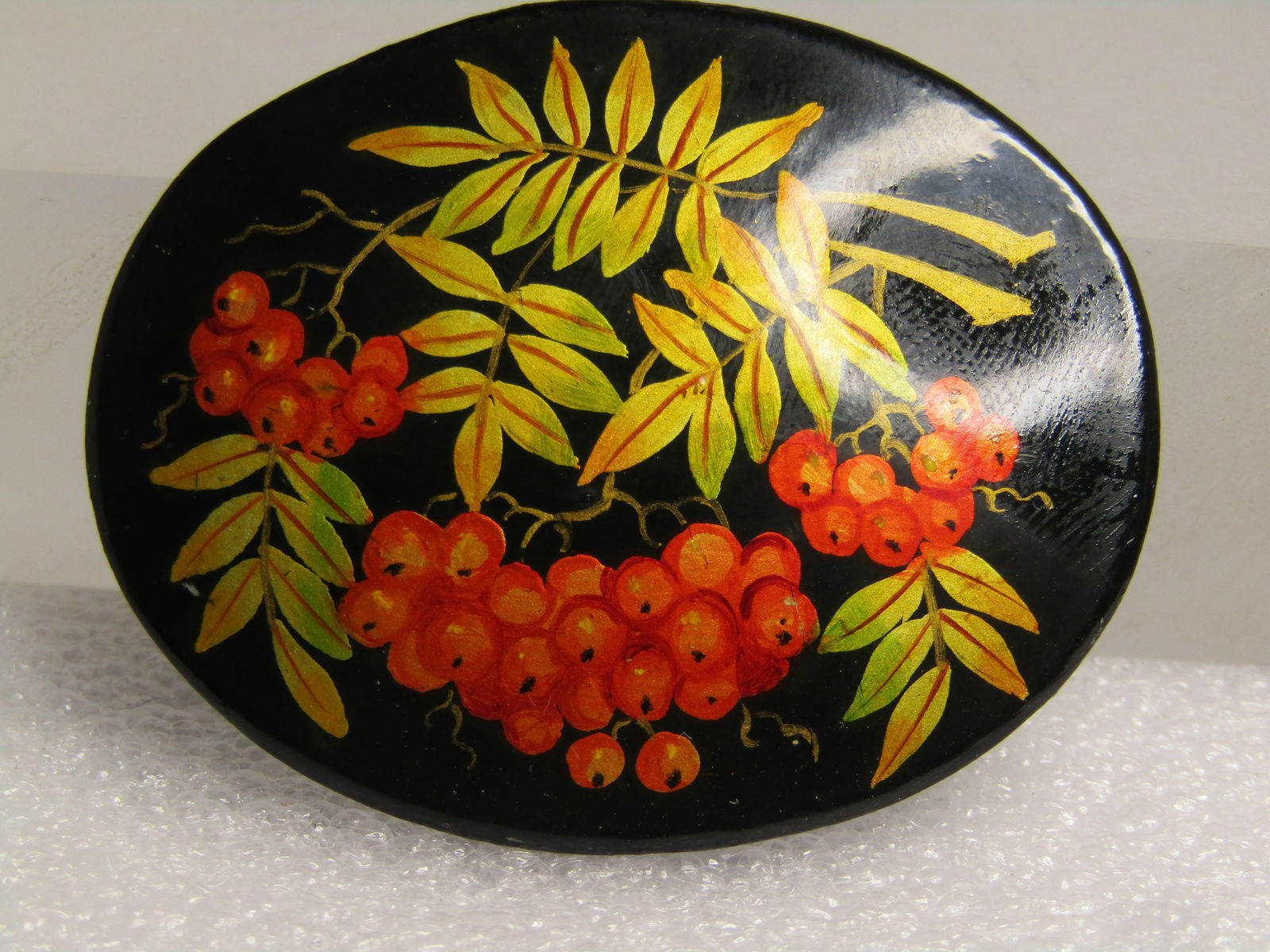 Vintage Painted Berry Brooch, Black, Lacqured, 1960's-1970's: Vintage Painted Berry Brooch, Black, Lacqured, 1960's-1970's. This has the look of coffee berries or cranberries. Black wooden slightly domed base with red berries in clusters and green leaves with
