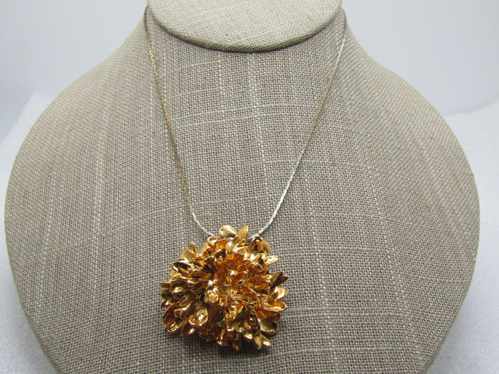 Vintage Gold tone Rustic Blossom Necklace, 16", 1970's: Vintage Gold tone Rustic Blossom Necklace, 16", 1960's-1970's. This has the look of a flowr that has been plated in a gold metal. The blossom is somewhat rustic and not perfect, just like a natural