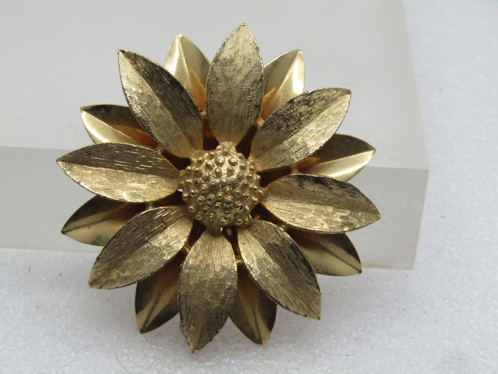 Vintage Sunflower Brooch, Tiered, Sarah Coventry, 1960's-1970's: Vintage Sunflower Brooch, Tiered, Sarah Coventry, 1960's-1970's. This is 2" across, textured petals on top with a dotted center and smooth petals on the bottom. Gold tone. Clean and very good