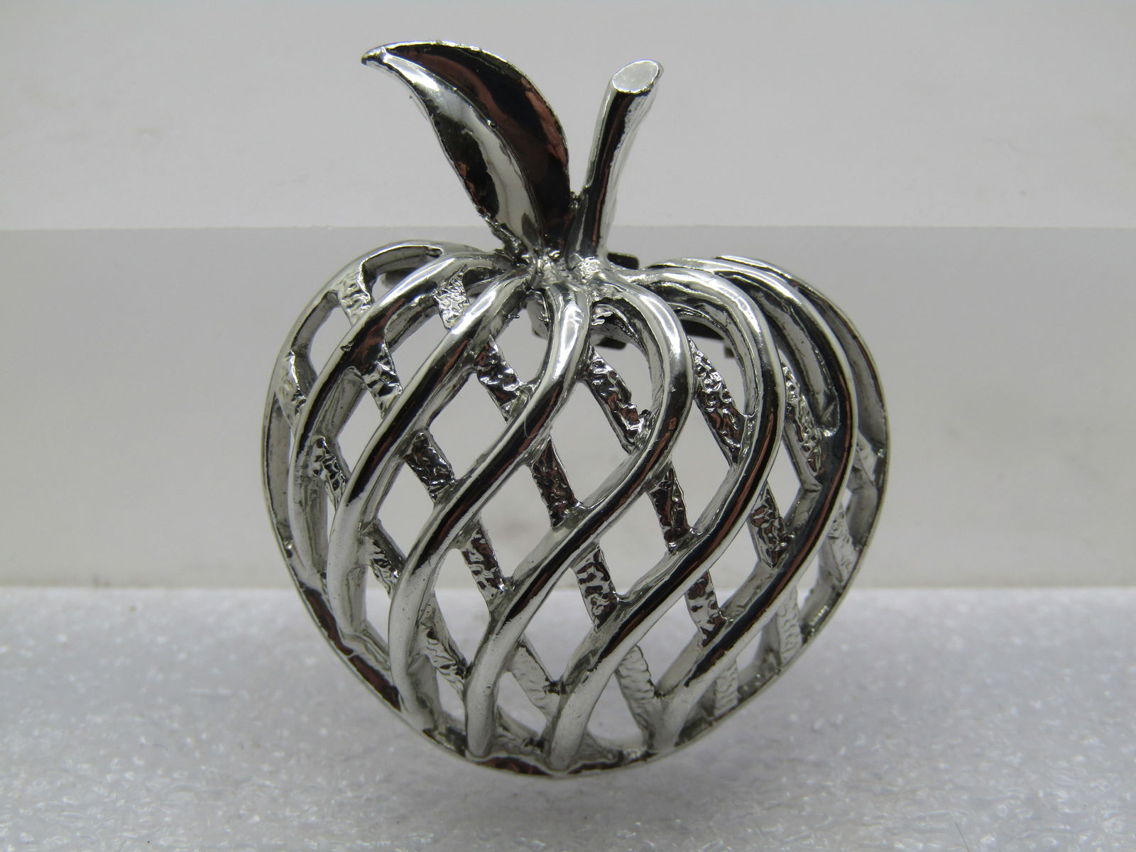 Vintage Woven Apple Brooch, 1960's, Signed Gerry's: Vintage Woven Apple Brooch and Pendant, 1960's, Signed Gerry's. Silver tone domed woven apple with textured lines set lower and smooth shiny lines crossing over in a wavy pattern. A singe leaf with