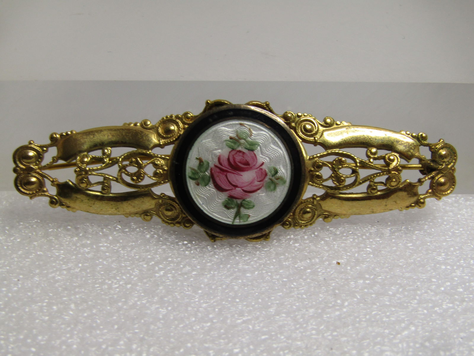 Vintage Filigree Guilloche Rose Brooch, 1930's-1940's: Vintage Filigree Guilloche Rose Brooch, 1930's-1940's. This is appx. 3" wide and slightly over 1" tall with a center round guilloche rose and scrolled filigree design in the brooch itself. Gold toen b