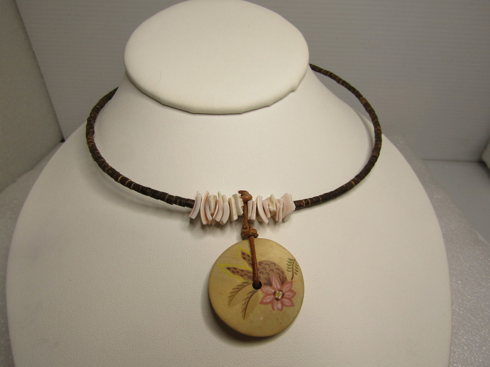 Vintage Brown Heishi Beaded Floral Pendant & SHell Necklace, 16" Coiled Collar, Post MId-Century: Vintage Brown Heishi Beaded Floral Pendant & SHell Necklace, 16" Coiled Collar, Post MId-Century. 1980's or slightly before or after. The brown beads over the coil appear to be a shell or some ot