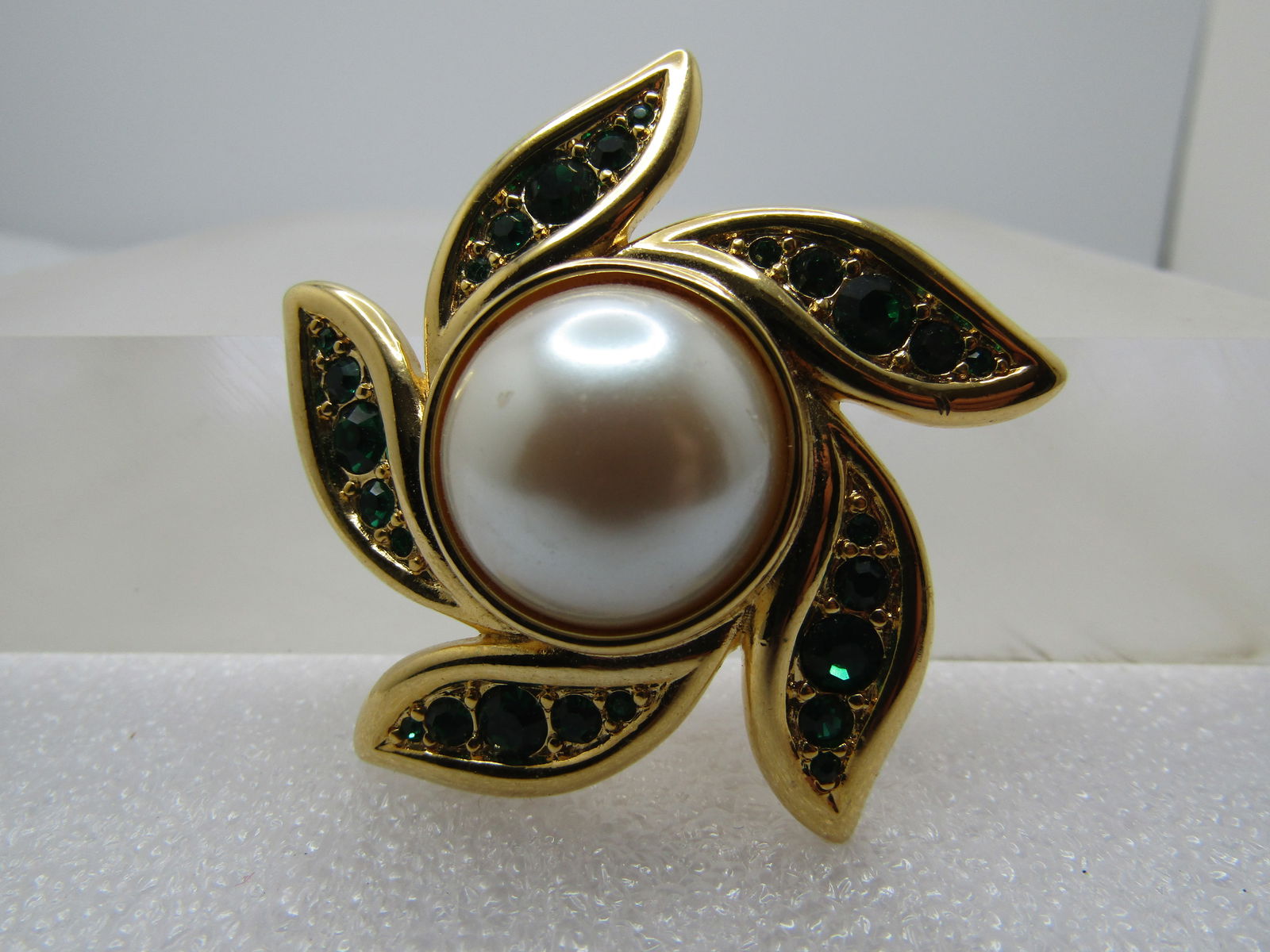 Vintage Faux Pearl Rhinestone Brooch, Blossom Spiral, Monet, 1970's-1980's: Vintage Faux Pearl Rhinestone Brooch, Blossom Spiral, Monet, 1970's-1980's. This is gold tone with a center half round faux pearl cabochon that is appx. 16mm set with glue/epoxy in the center of a sho