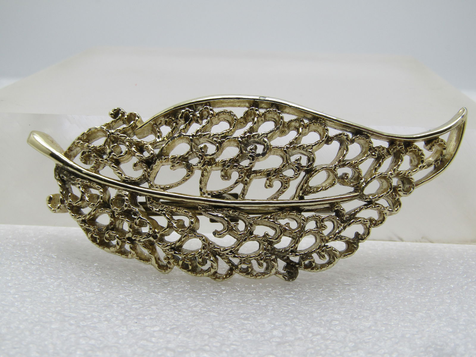 Vintage Long Filigree Leaf Brooch, 1960's-1970's: Vintage Long Filigree Leaf Brooch, 1960's-1970's. Gold tone and domed. It is appx. 3" long and 1.25" wide. It is not marked or signed. Locking clasp. Very good condition. (W8415.4 SS14376 J AZ LD 8/12