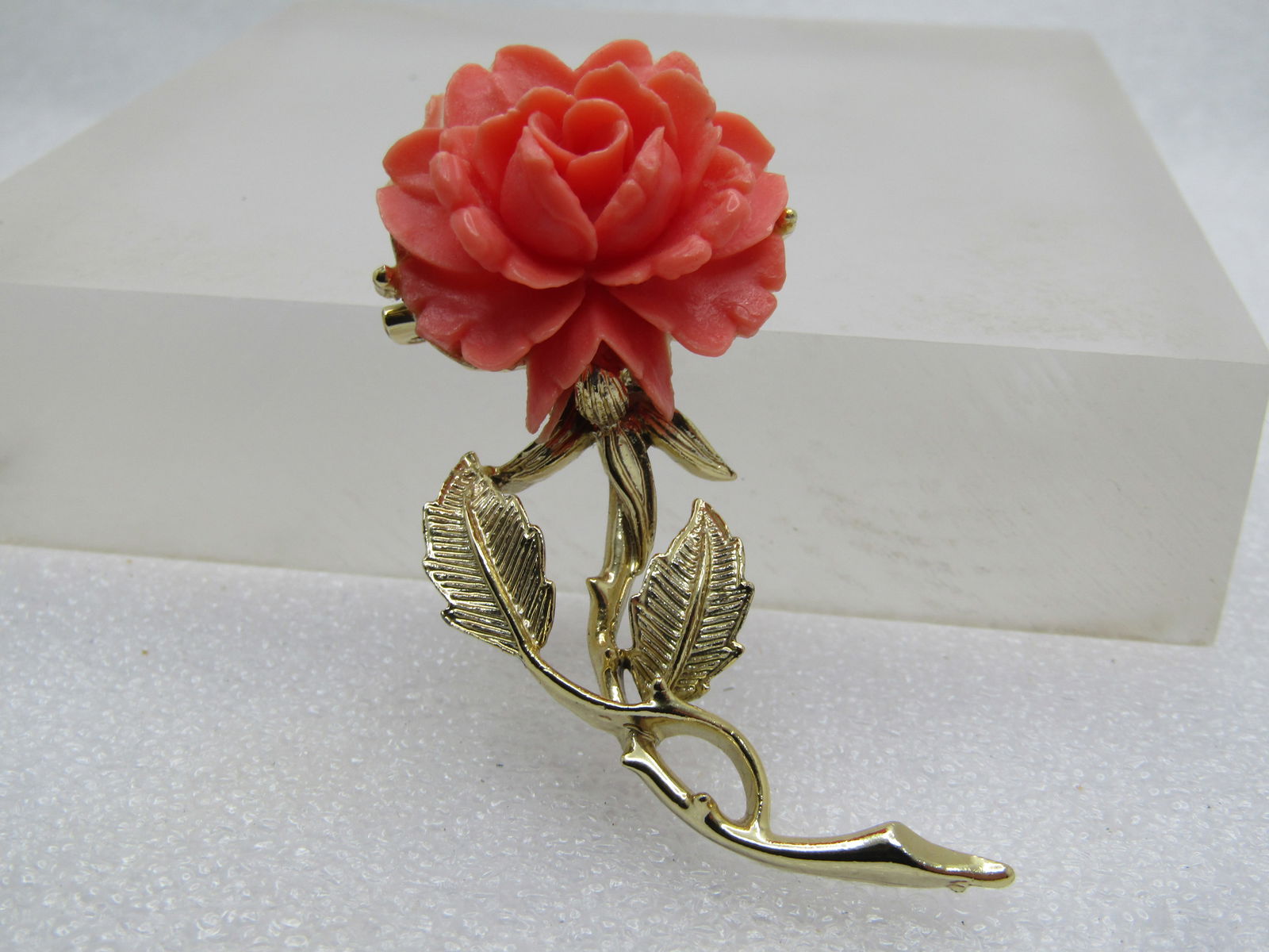 Vintage Faux Coral Rose Stem Brooch, 1960's, Signed Gerry's: Vintage Faux Coral Rose Stem Brooch, 1960's, Signed Gerry's 2.25" tall and appx. 1-1/8" wide. Faux coral molded rose blossom on top with a gold tone stem and leaves with textured and smooth finish. 