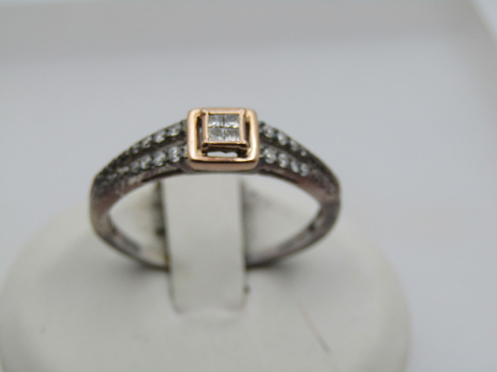 Sterling 10kt Diamond Engagement Ring, .20 TCW Signed IKS, Sz. 9.75: Title:Sterling 10kt Diamond Engagement Ring, .20 TCW Signed IKS, Sz. 9.75Description:Sterling 10tKt Diamond Engagement Ring, .20 TCW Signed IKS, Sz. 9.75. Sold in October 2012 through Zales . Four