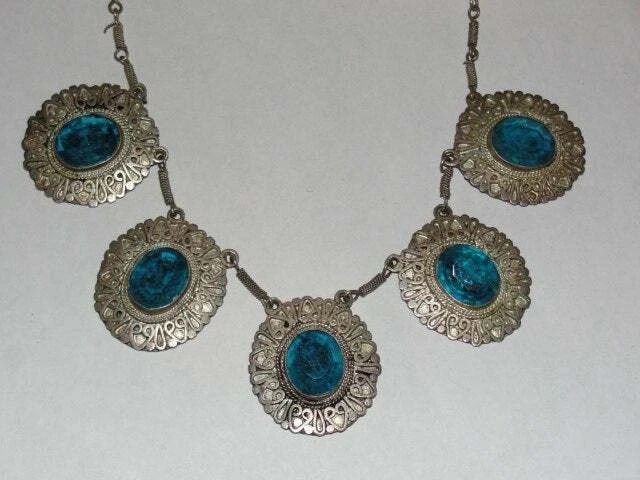 Sterling Silver and Faceted Blue Glass Necklace: Title:Sterling Silver and Faceted Blue Glass NecklaceDescription:Great hand made necklace. Circa 1950's. Each section is hand made and bezel set. All blue faceted stones are glass and