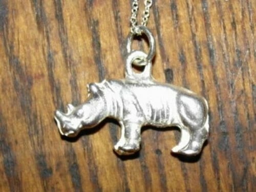 Sterling Silver Rhino Animal Charm Necklace Alberto Juan: Title:Sterling Silver Rhino Animal Charm Necklace Alberto JuanDescription:This sterling silver rhino charm necklace is the 3rd piece in my 14th collection of "Charms". Sterling silver rhinoceros