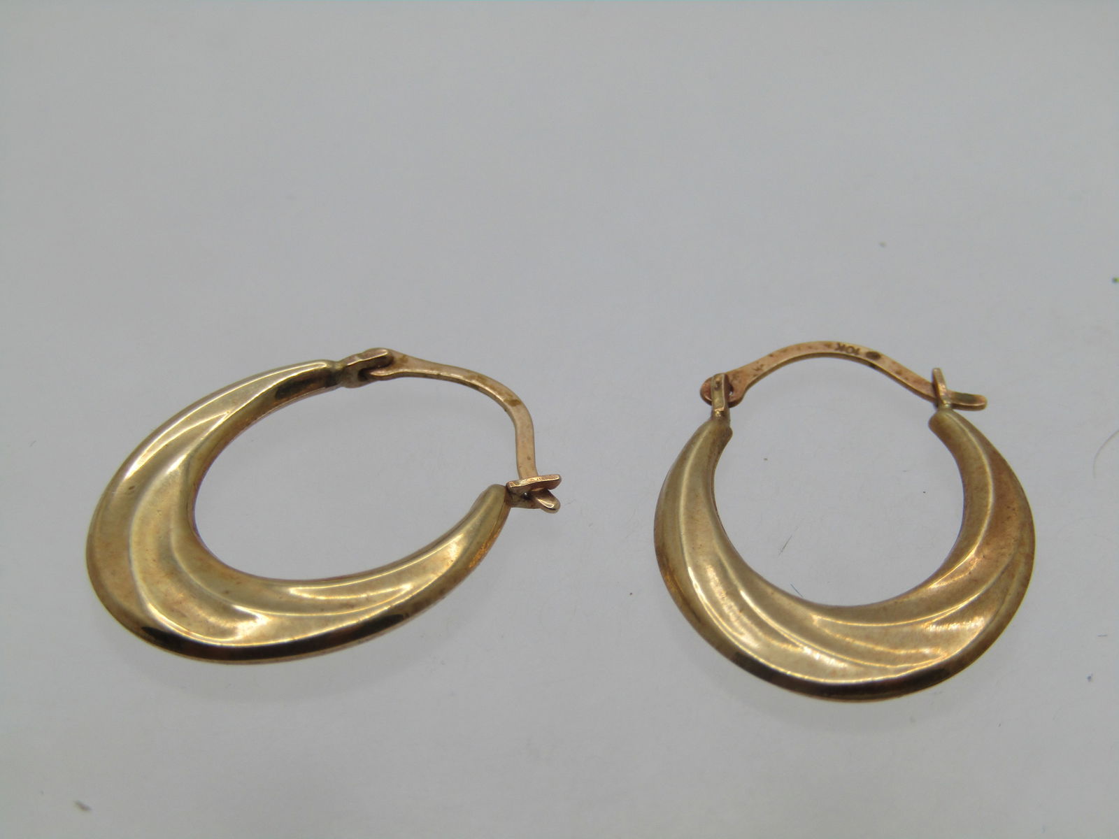 Vintage 10kt Gold Hoop Pierced Earrings, 1970's-1980's: Title:Vintage 10kt Gold Hoop Pierced Earrings, 1970's-1980'sDescription:Vintage 10kt Gold Hoop Pierced Earrings, 1970's-1980's. The hoops are wider at the base and taper from appx. 1.8mm to 5.2mm