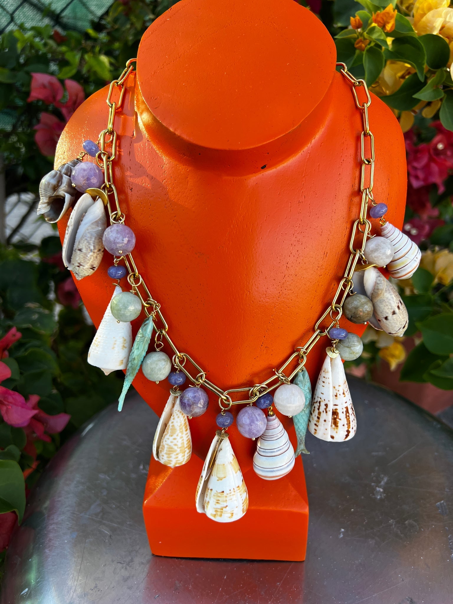 CSS 22" Cone Shell Necklace with Tanzanite, Amethyst and Fish: Title:CSS 22" Cone Shell Necklace with Tanzanite, Amethyst and FishDescription:Charm necklace featuring fun cone shells with Tanzanite, faceted beads of Green and Lavender Amethyst and even little