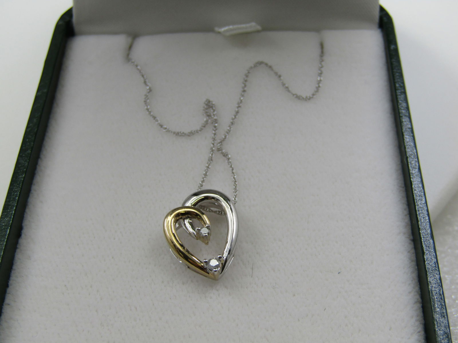 10kt Two-Tone Diamond Heart Necklace, 18", Modern heart: Title:10kt Two-Tone Diamond Heart Necklace, 18", Modern heartDescription:10kt Two-Tone Diamond Heart Necklace, 18", Modern heart with four diamonds, yellow and white gold . Raised design that the