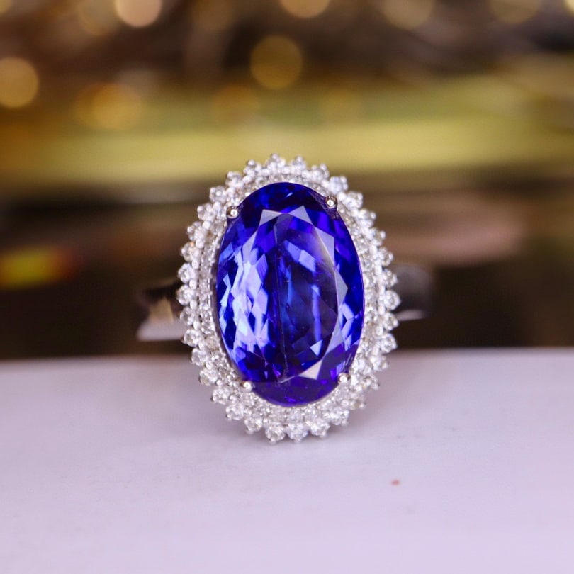 14K GOLD 3.49 CTW NATURAL TANZANITE & DIAMOND RING: Title:14K GOLD 3.49 CTW NATURAL TANZANITE & DIAMOND RINGDescription:Ref:230528497Gold Content:14K GoldRing Size:7.25USMain Gemstone:TanzaniteNumber of stones:1Shape:OvalCarat Weight:2.95ct