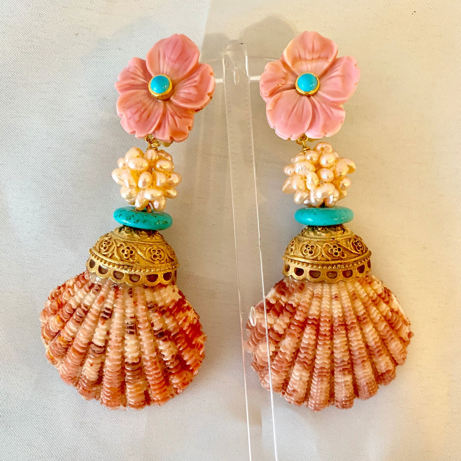 Big Pink Shell Earrings: Title:Big Pink Shell Earrings Description:By the sea, by the sea, by the wonderful sea, you can wear, you can always wear splashy, carved Conch Vermeil Earrings set with Sleeping Beauty Cabochons! Dro