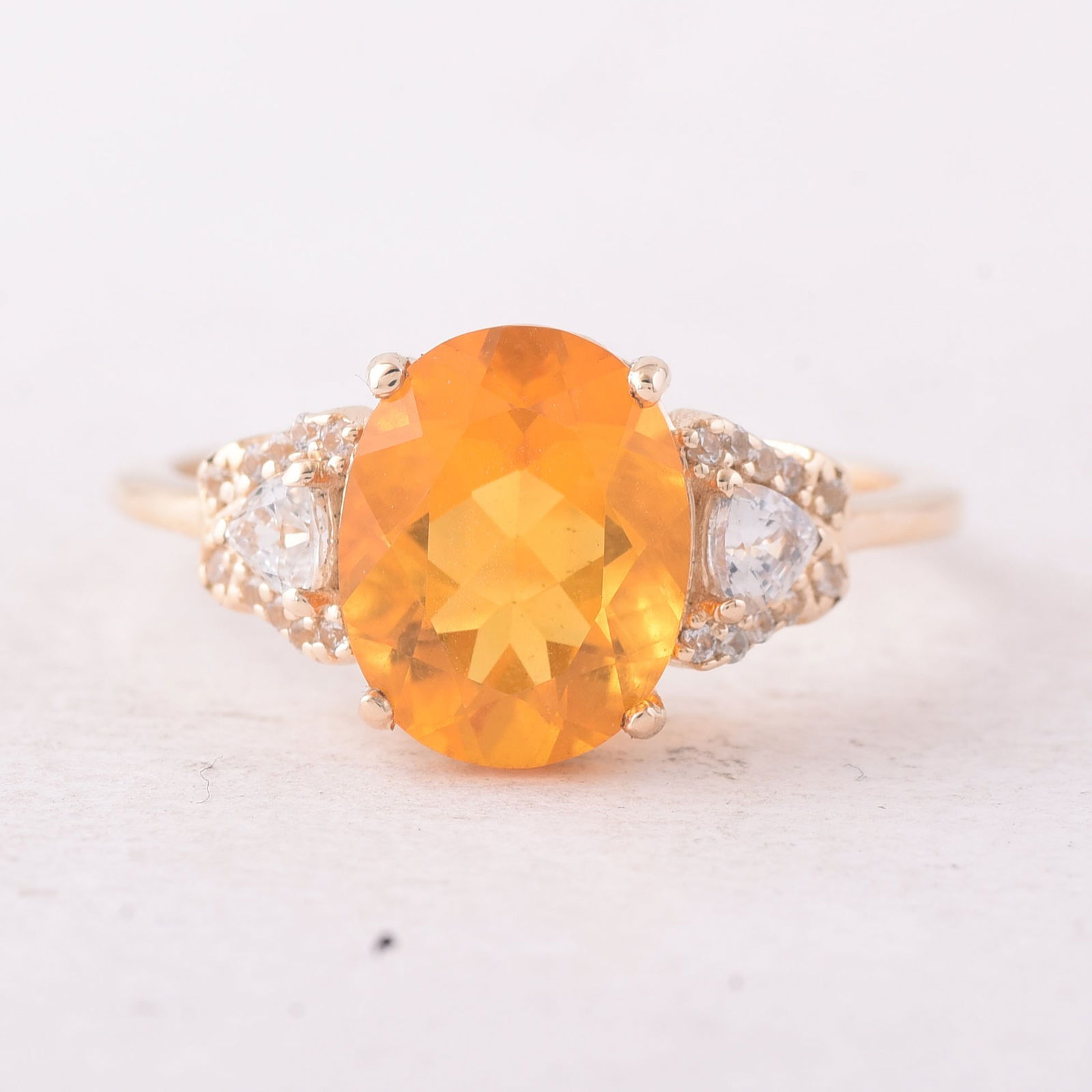 2.09 Ct Oval Fire Opal 9K Gold Ring: Title:2.09 Ct Oval Fire Opal 9K Gold RingDescription:2.09 Total Carat Fire Opal 9K Gold Ring Specifications - Total Weight 2.312 g - Center Gemstone Fire Opal - Gemstone Carat Weight 1.76 Carats -