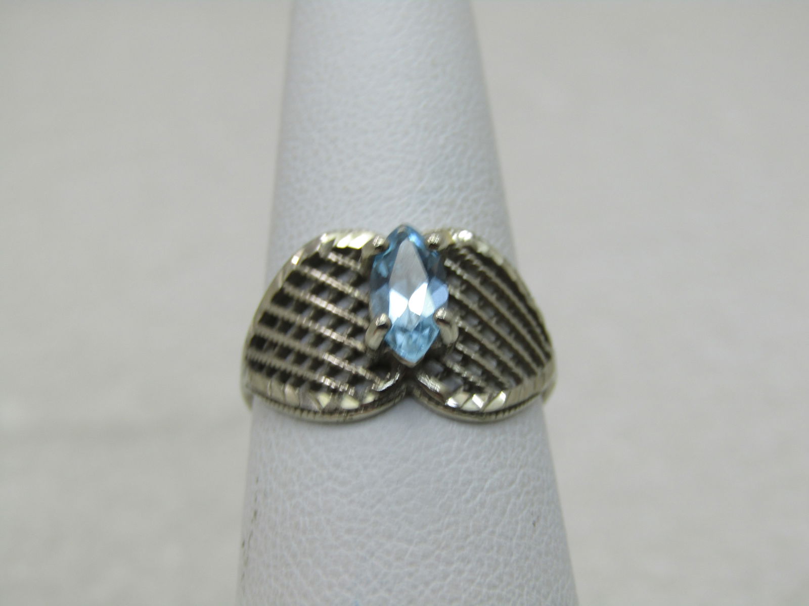 Vintage 10kt Marquise Blue Topaz Ring, Mesh Setting, MOD, 1980's-1990's: Title:Vintage 10kt Marquise Blue Topaz Ring, Mesh Setting, MOD, 1980's-1990'sDescription:Vintage 10kt Marquise Blue Topaz Ring, Mesh Setting, MOD, 1980's-1990's, Weight is apx. 2.38 grams. Sz. 7,