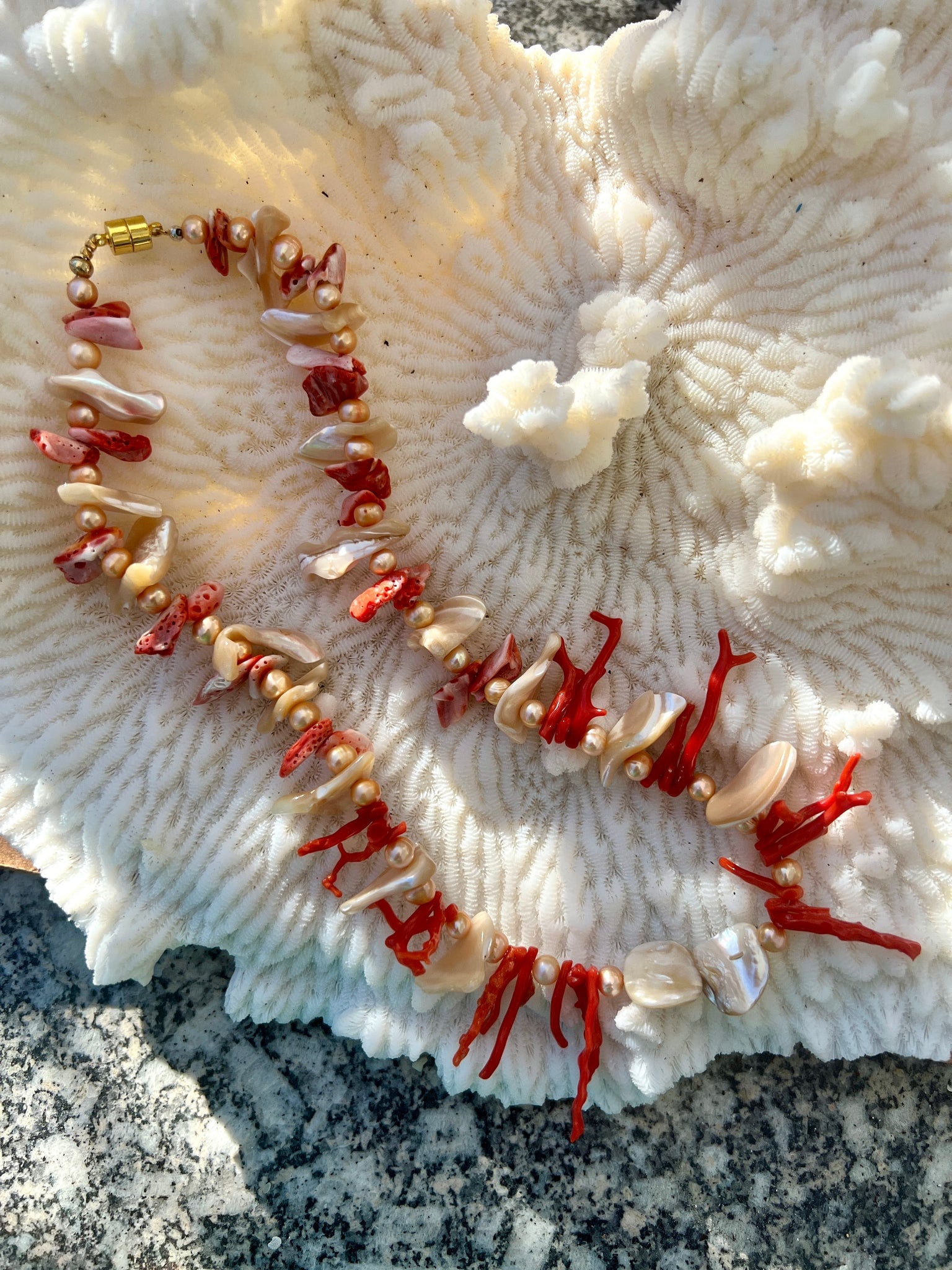 Spondilius Shell & Coral Necklace: Title:Spondilius Shell & Coral Necklace Description:Magical colors in this cut-shell, golden pearls, Spondilius and Italian Coral 14" necklace. The color of this cut shell was used by Ralph Lauren to