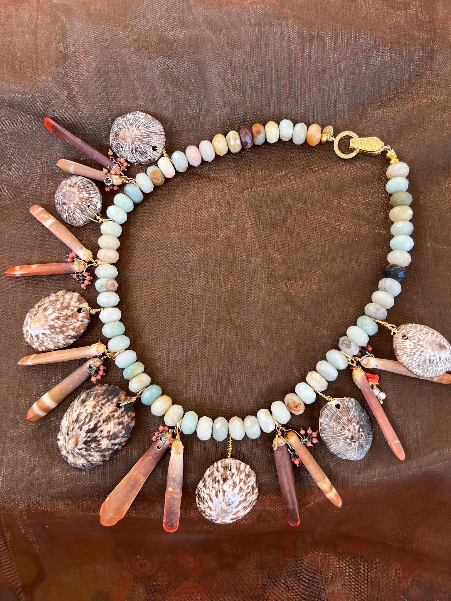 Ocean Jasper Necklace with Limpets, Urchins and Coral Beads: Title:Ocean Jasper Necklace with Limpets, Urchins and Coral Beads Description:Colors of the land and sea in this Ocean Jasper necklace with Brown Limpets, Sea Urchin Spines and tiny coral beads. Signe
