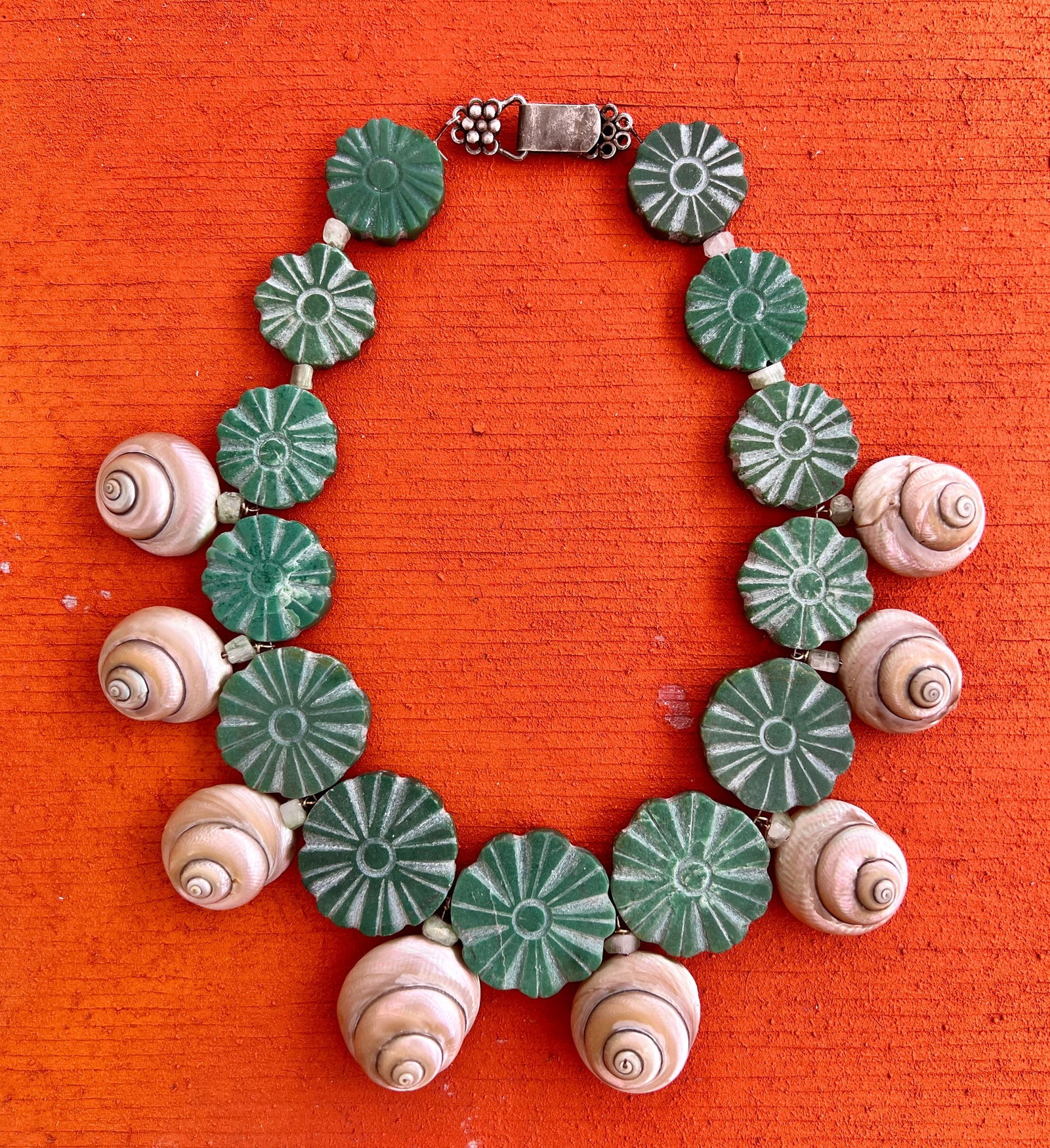 Amazonite Coin Necklace with Turbo Shells: Title:Amazonite Coin Necklace with Turbo Shells Description:Stylized Daisies carved in a sutiaable, unpolished Amazonite Coins. Antique ivory-colored, semi-pearled Turbo shells add a fun note. Necklac