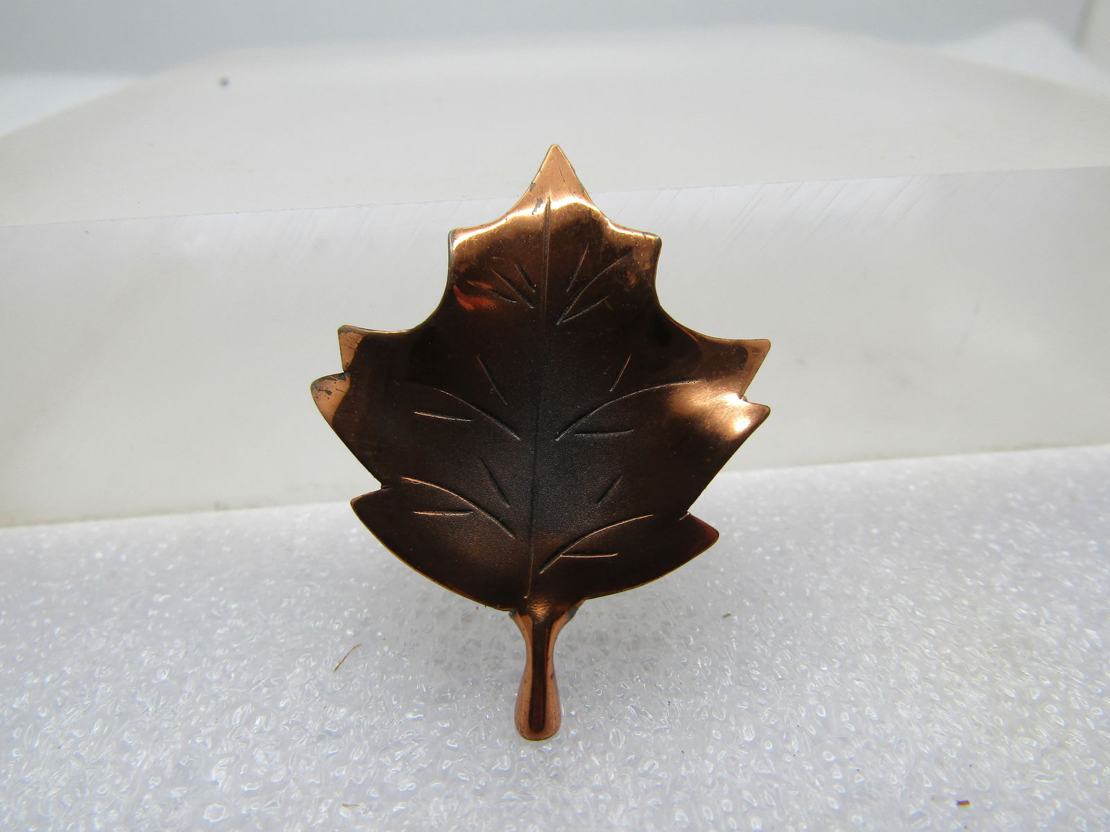 Vintage Copper Leaf Brooch, 1960's-1970's: Vintage Copper Leaf Brooch, 1960's-1970's. It is appx. 1.5" long and 1" wide. Etched vein and details in the leaf and slightly recessed in the center. Locking clasp. It is not marked or signed. Very g
