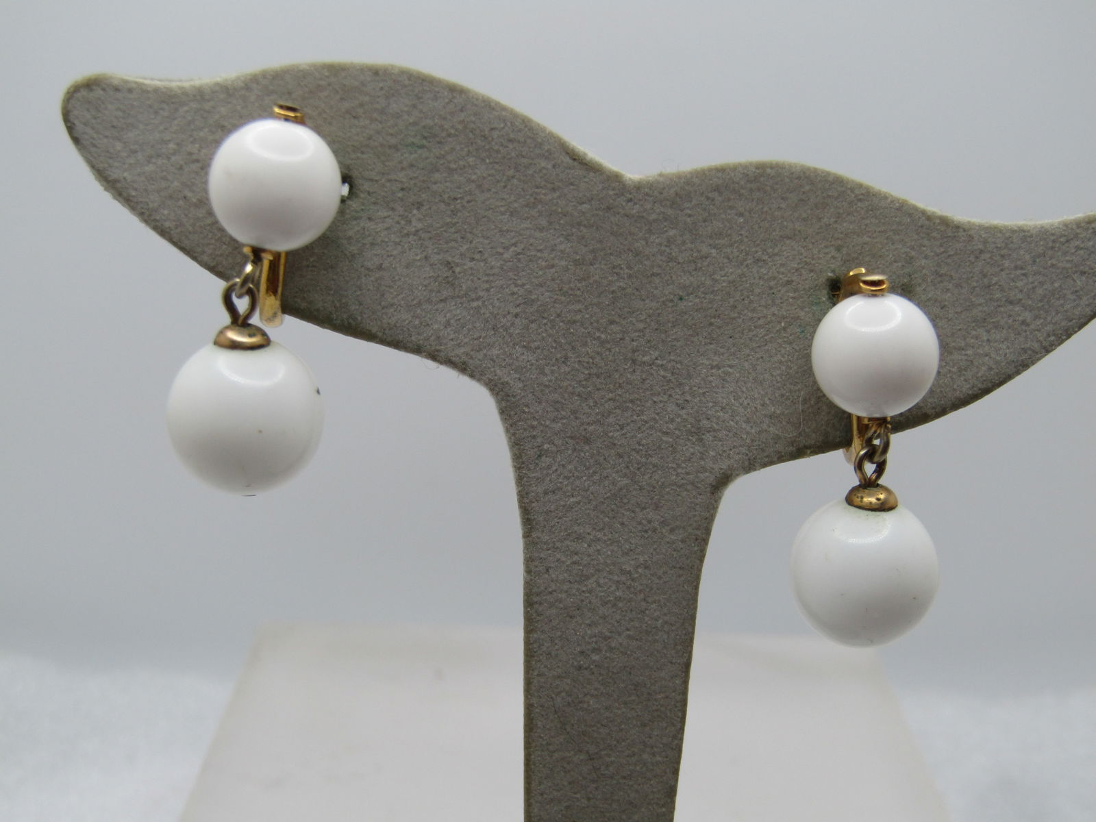 Vintage Napier White Stud & Drop Earrings, Clip, 1970's-1980's: Vintage Napier White Stud & Drop Earrings, Clip, 1970's-1980's. The bead on the stud is appx. 9.5mm and the dangle is 12.5mm". Gold tone. Signed Napier. They are appx.1.25" long - the bead at the