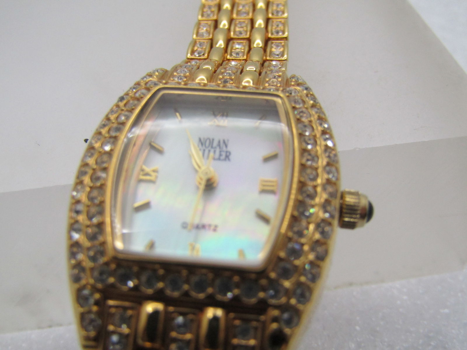 Nolan Miller Rhinestone Ladies' Watch, Quartz, Works, 7", 1990's-2000's: Nolan Miller Rhinestone Ladies' Watch, Quartz, Works, 7", 1990's-2000. Nolan Miller pieces very poular on QVX. This wa tch has rhinestone accents in the links and around the face. it is gold tone